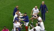 France's Olivier Giroud celebrates with coach Didier Deschamps and the coaching staff after the FIFA World Cup Qatar 2022 semi-final win against Morocco at the Al Bayt Stadium in Al Khor, Qatar, on December 14, 2022.  REUTERS/Peter Cziborra
 