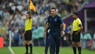 Argentina's coach Lionel Scaloni reacts on the touchline during the Qatar 2022 World Cup semi-final match between Argentina and Croatia at Lusail Stadium in Lusail, north of Doha on December 13, 2022. (Photo by JUAN MABROMATA / AFP)