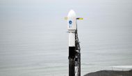 A SpaceX Falcon 9 rocket stands on a launch pad with the Surface Water and Ocean Topography (SWOT) satellite from NASA and France's space agency CNES at the Vandenberg Space Force Base in Lompoc, California on December 15, 2022. Photo by Patrick T. Fallon / AFP