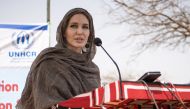 In this file photo taken on June 20, 2021, US actress Angelina Jolie, United Nations High Commissioner for Refugees (UNHCR) special envoy, gives a statement in Goudebou, a camp that welcomes more than 11,000 Malian refugees in northern Burkina Faso, on International Refugee Day. (Photo by OLYMPIA DE MAISMONT / AFP)