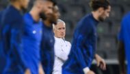 France's coach Didier Deschamps takes part in a training session at the Al Sadd SC training centre in Doha on December 17, 2022, on the eve of the Qatar 2022 World Cup football final match between Argentina and France. (Photo by FRANCK FIFE / AFP)