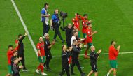 Morocco players and officials applaud the fans after their third-place match against Croatia at the Khalifa International Stadium yesterday.  REUTERS