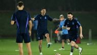 Argentina's Lionel Messi and Angel Di Maria during a FIFA World Cup Qatar 2022 training at the Qatar University Training Site 3, Doha, Qatar, on December 17, 2022.  REUTERS/Dylan Martinez
 