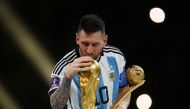 Argentina’s Lionel Messi kisses the World Cup trophy after receiving the Golden Ball award on Sunday. REUTERS