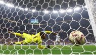 Argentina’s Leandro Paredes scores a penalty during the penalty shootout past France’s Hugo Lloris. REUTERS