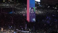 Argentina fans celebrate winning the FIFA World Cup at the Obelisk with an image of Leo Messi in Buenos Aires, Argentina on December 18, 2022.  REUTERS/Mariana Nedelcu
 