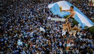  In this aerial view fans of Argentina celebrate winning the Qatar 2022 World Cup against France at the Obelisk in Buenos Aires, on December 18, 2022. (Photo by TOMAS CUESTA / AFP)