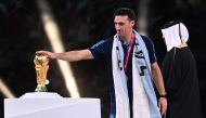 Argentina's coach Lionel Scaloni touches the FIFA World Cup Trophy during the trophy ceremony after Argentina won the Qatar 2022 World Cup final football match between Argentina and France at Lusail Stadium in Lusail, north of Doha on December 18, 2022. (Photo by Kirill KUDRYAVTSEV / AFP)
 