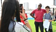 FIFA World Cup Ambassador Marcel Desailly poses with a Youth Programme participant. 