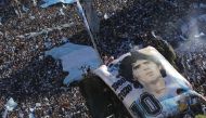 General view as Argentina fans with a Diego Maradona banner celebrate after winning the World Cup by the Obelisco in Buenos Aires. Reuters 