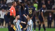 Argentina's Lionel Messi and Leandro Paredes celebrate after winning the FIFA World Cup Qatar final match against France at Lusail Stadium on December 18, 2022. (REUTERS/Lee Smith)