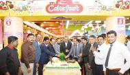 Safari Group Chairman Aboobakar Madappat, Director and Group General Manager Zainul Abideen and other officials cutting a cake to mark the launch of the promotion.