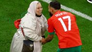 Morocco’s Sofiane Boufal celebrates with his mother as Morocco progress to the semi finals. 