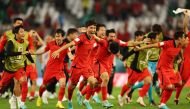 South Korea’s Hwang In-beom celebrates with teammates after South Korea qualified for the knockout stages. REUTERS