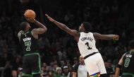 Boston Celtics guard Jaylen Brown (7) shoots the ball over Minnesota Timberwolves guard Anthony Edwards (1) during the second half at TD Garden. Bob DeChiara