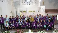 Ambassador Ridwan Hassan with Indonesians who volunteered for Qatar 2022.