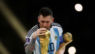 Argentina's Lionel Messi kisses the World Cup trophy after receiving the Golden Ball award as he celebrates after winning the FIFA World Cup Qatar 2022 tournament at the Lusail Stadium in Lusail, Qatar, on December 18, 2022. File Photo / Reuters

