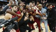 The Cleveland Cavaliers celebrate with guard Donovan Mitchell (45) after the game between the Cavaliers and the Chicago Bulls at Rocket Mortgage FieldHouse. Ken Blaze