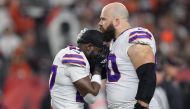 In this file photo taken on January 2, 2023, Tre'Davious White and Mitch Morse of the Buffalo Bills, react to teammate Damar Hamlin, collapsing after making a tackle against the Cincinnati Bengals during the first quarter at Paycor Stadium in Cincinnati, Ohio. (Photo by Dylan Buell / Getty Images NA / AFP)