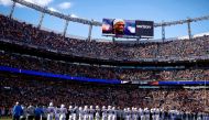 Los Angeles Chargers and Denver Broncos players stand for a moment of silence to honor Buffalo Bills player Damar Hamlin in the first quarter at Empower Field at Mile High, Denver, Colorado, US, January 8, 2023. (Isaiah J. Downing-USA TODAY Sports via Reuters)