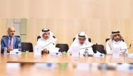 QU President Dr. Hassan Al Derham (right) with other officials during the meeting.