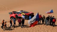 French driver Sebastien Loeb and Belgian co-driver Fabian Lurquin steer their BRX during the Stage 10 of the Dakar 2023, between Haradh and Shaybah, Saudi Arabia, on January 11, 2023. (Photo by FRANCK FIFE / AFP)