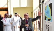 President of Qatar University Dr. Hassan Al Derham views some of the research presentations.