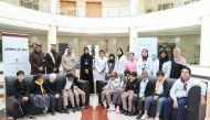 Officials with the students during an awareness and dental screening event. 