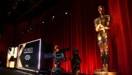 A camera operator stands next to an Oscar statue ahead of the announcement of the 95th Oscars Nominations in Beverly Hills, California, US, January 24, 2023. (REUTERS/Mario Anzuoni)