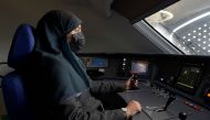 Saudi conductor Raneem Azzouz, drives a high-speed train ferrying pilgrims to Mecca, in Saudi Arabia, on January 22, 2023. (Photo by Amer Hilabi / AFP)
