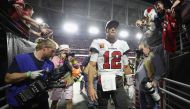 In this file photo taken on December 25, 2022, Quarterback Tom Brady of the Tampa Bay Buccaneers walks off the field following the NFL game at State Farm Stadium in Glendale, Arizona. - Brady announced his retirement on February 1, 2023, at the age of 45 after a storied career that included a record-breaking seventh Super Bowl victory in 2021 and a temporary retirement last year. 