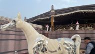 Tarek Maarkach working on his life-size horse mirror mosaic. Pics: Joelyn Baluyut/The Peninsula