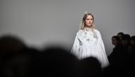 A model presents a creation for Paskal during the Autumn/Winter 2023 Ukrainian fashion week show collection on the fifth day of the London Fashion Week, in London, on February 21, 2023. (Photo by JUSTIN TALLIS / AFP) 