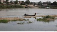 A boy sits in a boat in Tigris River in Baghdad, Iraq June 4, 2018. (Reuters)
