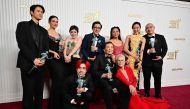 Actors Michelle Yeoh, Ke Huy Quan, Stephanie Hsu, Jamie Lee Curtis, James Hong, Jenny Slate, Harry Chum Jr. and cast pose with the award for Outstanding Performance by a Cast in a Motion Picture for 