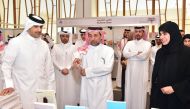 From LEFT: Minister of Culture H E Sheikh Abdul Rahman bin Hamad bin Jassim Al Thani, QU President Dr. Hassan Al Derham and Vice President for Research and Graduate Studies Prof Mariam Al Maadeed tour the QU Book Fair.