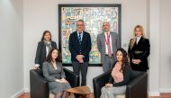 Olivier Huynh Van, Director of the French Institute and Counsellor for Cooperation and Cultural Affairs of French Embassy in Qatar pose for a group photo with other officials.