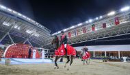 Riesenbeck International riders Christian Kukuk and Philipp Weishauppt celebrate after their win in the Global Champions League at the Longines Arena at Al Shaqab yesterday.