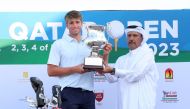 Qatar Golf Association's Deputy General-Secretary Eng. Mohammed Ibrahim Al Muhannadi presents the trophy to Joe Jones.