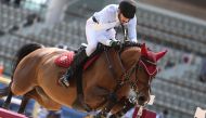 Mohammed Khalifa Al Baker guides What A Pleasure over an obstacle during the Open Class competition.