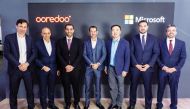 Aziz Aluthman Fakhroo, Managing Director and Group Chief Executive Officer at Ooredoo, with other officials from Ooredoo and Microsoft.