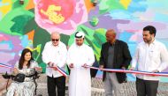 Katara General Manager Prof. Dr. Khalid bin Ibrahim Al Sulaiti (centre), Ambassador of the Dominican Republic to Qatar, H E Georges Bahsa Hazim (second left), artist Jerson Jimenez (second right), along with other officials during the inauguration of ‘Bayabihe Rose’ mural.