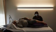 Pat Hill, who has long-covid symptoms, receives acupuncture treatment from Gayla Marie Stiles at University Hospitals Connor Whole Health in Rocky River, Ohio. The Washington Post/Da'Shaunae Marisa.
