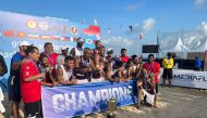 Qatar handball players and officials celebrate after winning the Asian title in Bali, yesterday.