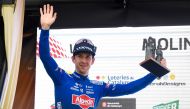 Stage winner Alpecin-Deceuninck's Australian rider Kaden Groves celebrates with the trophy on the podium after the 6th stage of the 2023 Volta Catalunya cycling tour of Catalonia, a 183 km race from Martorell to Molins de Rei, on March 25, 2023. (Photo by Josep LAGO / AFP)