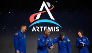 (L-R) Astronauts Jeremy Hansen, Victor Glover, Reid Wiseman and Christina Hammock Koch celebrate after being selected for the Artemis II mission who will venture around the Moon during a news conference held by NASA and CSA at Ellington airport in Houston, Texas, on April 3, 2023. (Photo by Mark Felix / AFP)