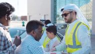 People line up to receive Iftar meals distributed under Ooredoo Kuwait’s Ramadan initiative.