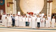 Officials with winners of the competition at the Katara mosque. 