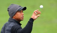 Tiger Woods of the United States catches a ball on the practice area during the third round of the 2023 Masters Tournament at Augusta National Golf Club on April 08, 2023 in Augusta, Georgia. Andrew Redington/Getty Images/AFP 