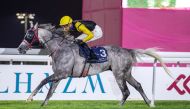 Al Balushi guides Ghannam to win at Al Rayyan Racecourse on Thursday night. Pics: Juhaim/QREC 